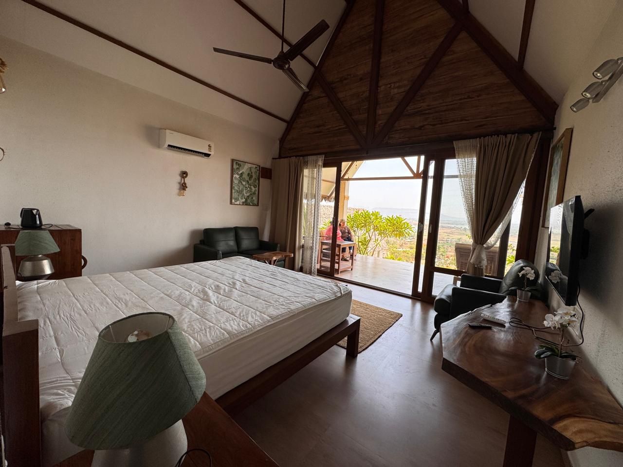 Chalet bedroom with doors open to the lake